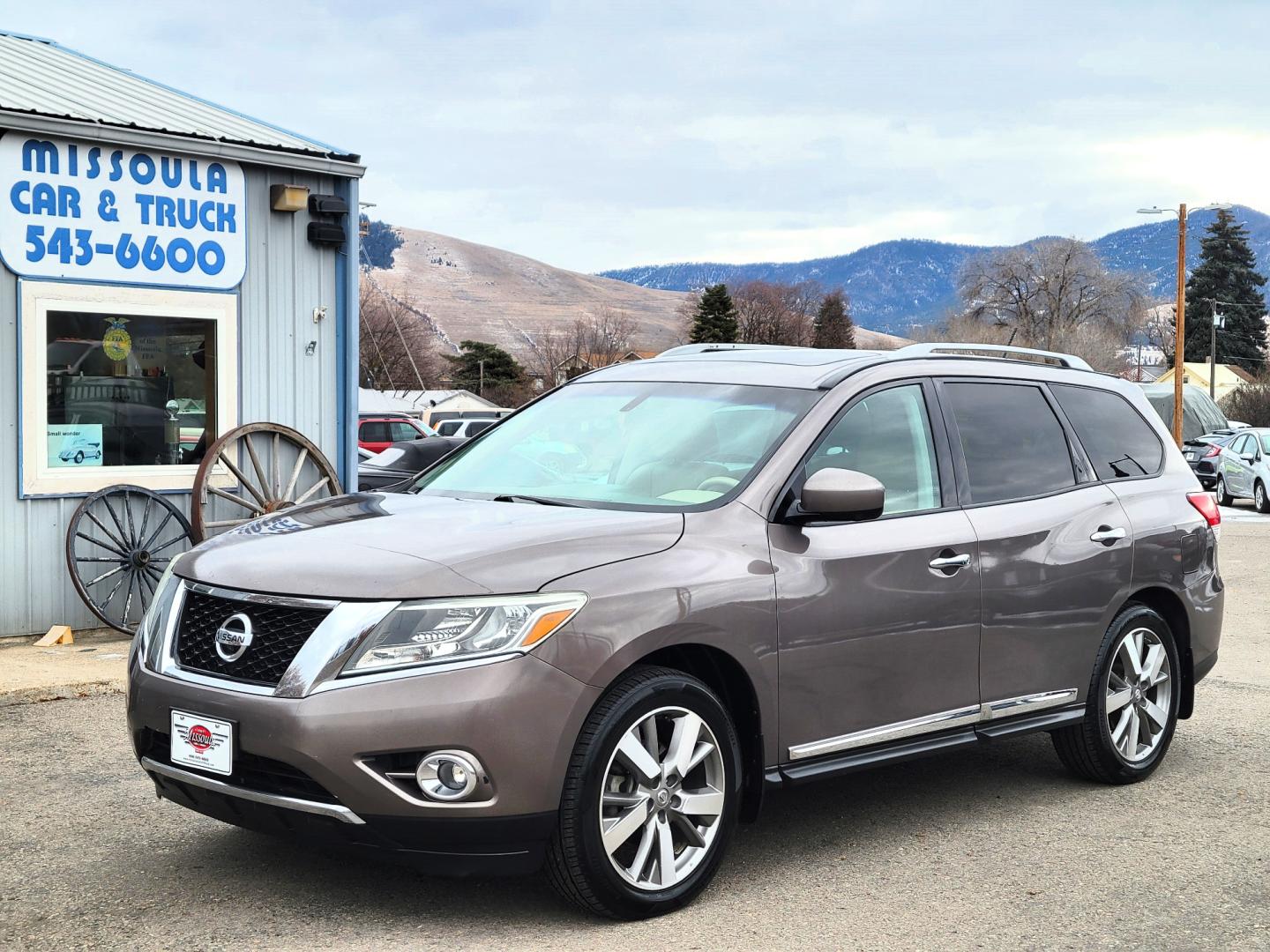 2013 Brown /Tan Nissan Pathfinder Platinum (5N1AR2MM1DC) with an 3.5L V6 engine, Automatic / CVT transmission, located at 450 N Russell, Missoula, MT, 59801, (406) 543-6600, 46.874496, -114.017433 - 4 Wheel Drive SUV. Power Sunroof. 3rd Row Seating. Heated Leather Front and Middle Seats. Power Front Seats. DVD Screens in Headrests. Navigation. Bluetooth. Backup Camera. AM FM CD DVD XM. Heated Steering Wheel. Towing. - Photo#1